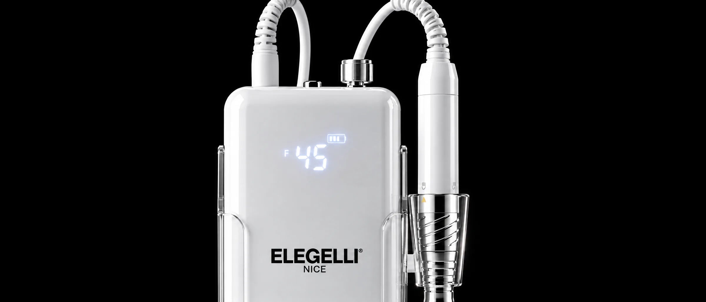 The Elegelli Nice nail drill docked on black glass in a dark studio, its readout glowing